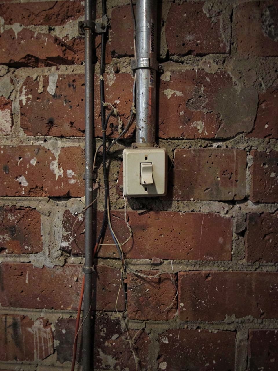 Technician using test device on outlet